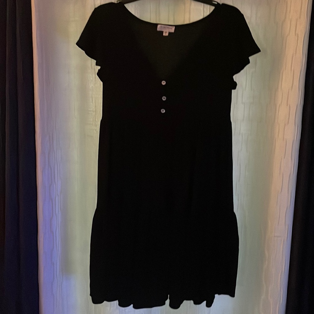Cute simple black dress. Very casual.